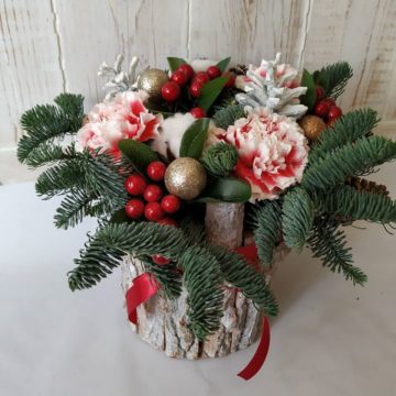 Composition of blue spruce branches, Christmas decorations, cotton, dried flowers.