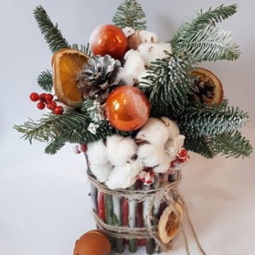 Composition of blue spruce branches, Christmas decorations, cotton, dried flowers.