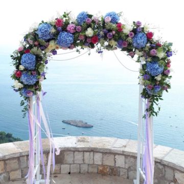 Wedding arch composition in the style of boho with hydrangea and green eucalyptus