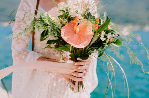 A light coral bouquet for a wedding in the style of Boho