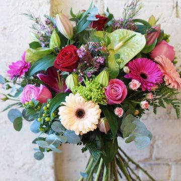 The bouquet is assembled from flowers of various grades and shades to create a positive mood.